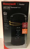 Front of the Honeywell heater box showing model details and key features including 180°/360° surround heat, ceramic technology, safety features, and 1500W power.