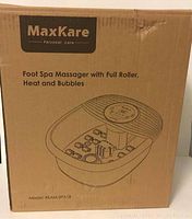 Box of MaxKare Foot Spa Massager with model information and illustration on front.