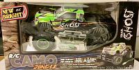Front view of the New Bright R/C Camo Jungle monster truck in original packaging showing green and black camouflage design.