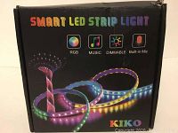 Box labeled 'Smart LED Strip Light' with RGB, music, dimmable and built-in mic features by Kiko