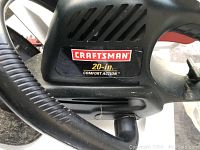 Close up image showing the Craftsman logo and 20-inch Comfort Action label on the hedge trimmer body.