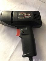 Image of black Sears Craftsman 3/8 drill showing label and body.