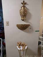Full view of all pieces: wall mount fountain and bowl above, marble plant stand with cherubs below