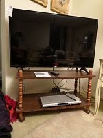 TV, DVD player and stand arrangement