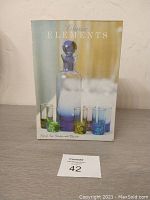 Boxed set of Classic Elements decanter and six colored shot glasses shown in original packaging.