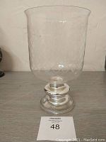 Full side view of the large glass vase showing etched diamond pattern and silver-tone pedestal base.