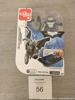 Front of sealed box showing Apptivity Batman EMP Assault figure in packaging with app logo and iPad interaction details.