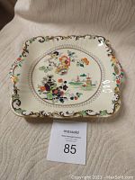 Front view of square Mason's china plate with floral and oriental design.