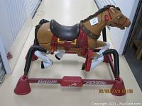 Side view of Radio Flyer rocking horse showing overall construction, spring-based rocking mechanism, and branding on the metal frame.