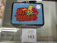 Photo of the lunch box closed showing top graphic of Bart Simpson skateboarding with 'No Problemo' text.