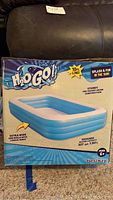 Boxed 10 ft long H2O GO H2O inflatable pool showing product details.