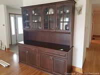 Front view of two-piece wooden hutch showing overall design and proportions.