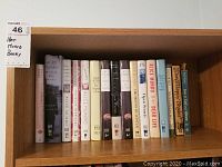 Shelf with 16 books, mainly by Alice Munro and related biographies, both hardcover and softcover.