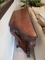 Full side view of table against wall and sofa