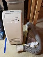 Front view of portable air conditioner showing intake vents and control panel area