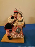 Front view of Polish national couple dolls, showing detailed clothing and facial features.
