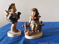 Both Goebel figurines together showing details and scale