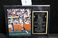 Front view of sealed plaque showing signed photograph and career highlights text
