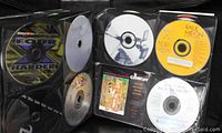 CDs in the zip-around Soundgear binder showing various discs like Raul Midon and movie soundtracks.