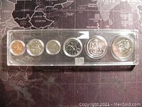 Full view of six 1974 Canadian coins in original plastic holder showing all coins in a row from smallest to largest.