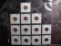 Full view of 12 Canadian 1 cent proof coins placed in protective holders.