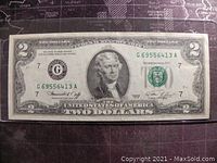 Front side of the 1976 US Two Dollar bill showing Thomas Jefferson portrait, serial numbers, and seals.