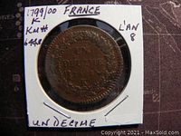 Obverse side of the 1799-1800 French Un Decime coin showing denomination, year (L'an 8) and wreath.