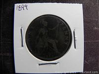 Reverse side of the 1899 Great Britain one penny coin with seated Britannia, date, and inscription.
