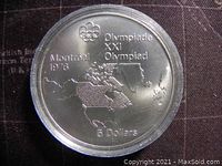 Reverse side featuring Montreal 1976 Olympic design with map of Canada and Olympic rings.