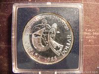 Obverse side of the 1983 Canadian Silver Jubilee Dollar coin showing the commemorative design with athletic figure and shield marked 'CANADA 1983 DOLLAR'