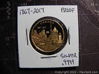 Reverse side of the coin showing detailed cityscape design with dates 1867-2017, labeled proof and silver .9999.