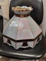 Front and top view of the pink and blue iridescent leaded glass ceiling lamp shade.