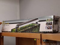 Side view of Fluval aquarium light box showing slight wear and tape on corners