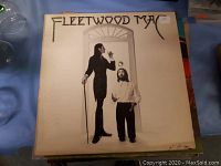 Front cover of Fleetwood Mac vinyl record album showing two men in black and white photography with stylized band name at top.