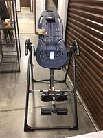 Full view of blue inversion table and frame