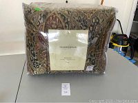 Full set in clear zippered plastic packaging showing paisley pattern and front label