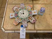 Lenox porcelain decorative clock with village house motif around the circular dial, along with small Heart and Home treasure box in pastel colors.