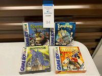 Four Game Boy Color game boxes arranged side by side, including Shrek, Toonsylvania, Godzilla, and El Dorado.