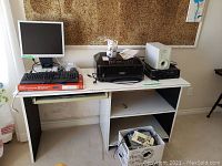 Overview of desk with HP monitor, Canon Pixma MX432 printer, AOpen subwoofer with satellite speaker, and box with miscellaneous items underneath desk