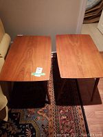 Two wooden rectangular end tables side by side showing overall design and finish
