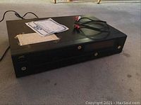 JVC XL-V101 CD player top and cables on carpet.