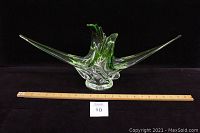 Front view of large Canadian Chalet glass sculpture with measuring ruler and lot number card.