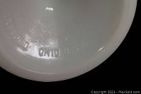 Close-up photo of inside base mark showing 'CLEVELAND OHIO USA' embossed in milk glass base.