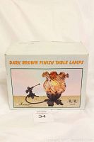 Box showing illustration of dark brown finish table lamp with metal cherub