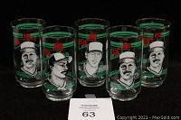 Front view of 5 vintage Frito Lay Toronto Blue Jays glasses showing portraits of three Ernie Whitt, one Lloyd Moseby, and one Tom Henke with logos and text.