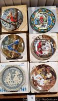 Overview of six collector plates with original boxes showing various themes including birds and fairy tales.