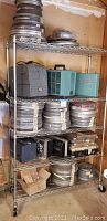 Overall view of shelves with metal film canisters and projectors