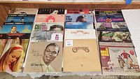 20 assorted vinyl LP records laid out showing various album covers and artist names.