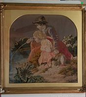 Full view of 19th century needlepoint tapestry in gold-colored antique frame with damaged ornate corners