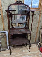 Full front view of entire etagere showing overall form.